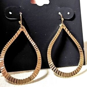 A pair of Raphael Earrings in gold tones.